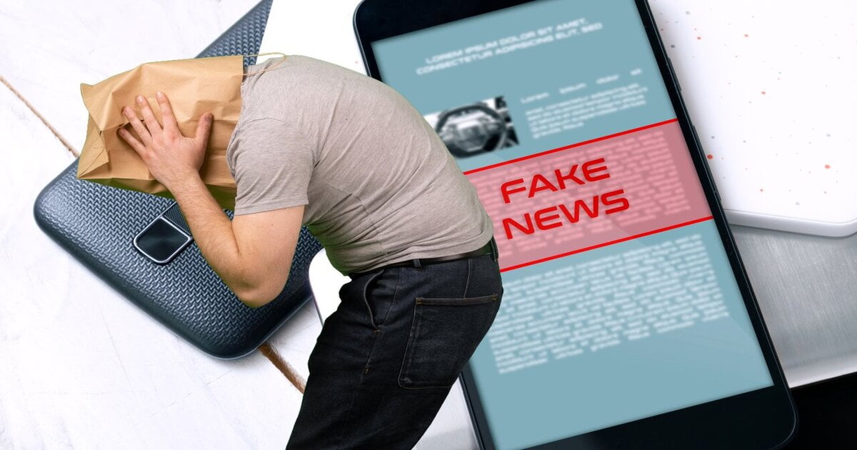 Image of a man facing sideways in a grey teeshirt, jeans and a paper back on his head against a backdrop of a mobile phone with a notification, Fake News on it.